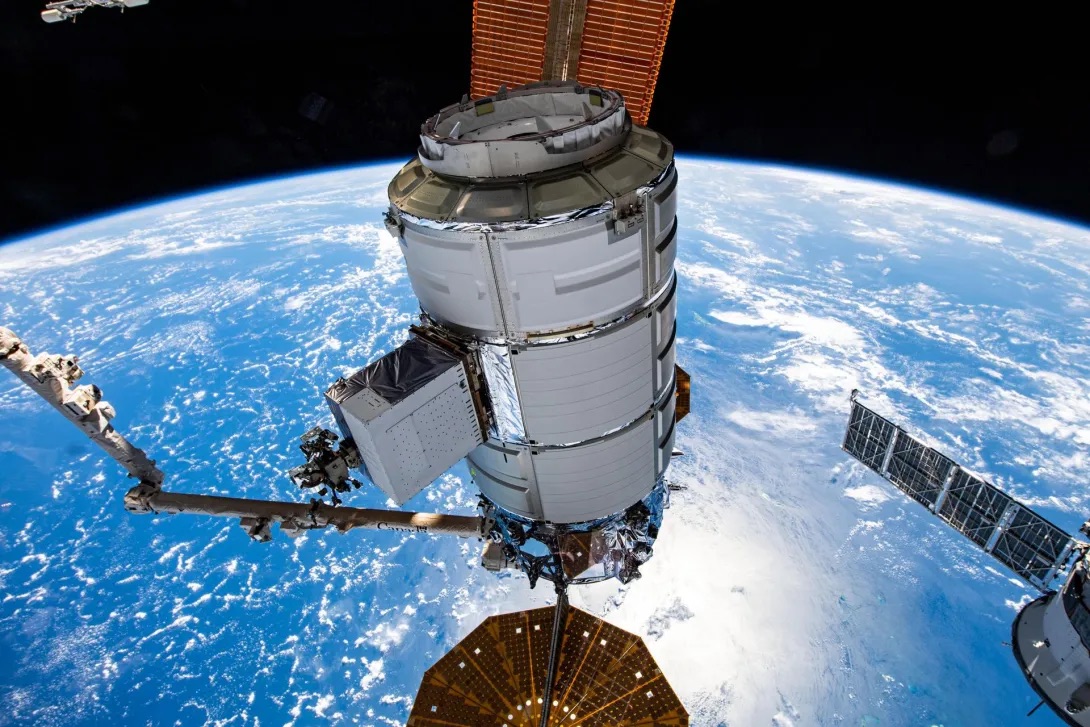 The International Space Station orbiting the Earth in outer space.