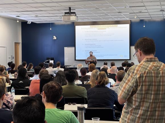 Executive Director Jud Ready presenting inside a room at the Marcus Nanotechnology Building for SRI&#039;s inaugural meeting.